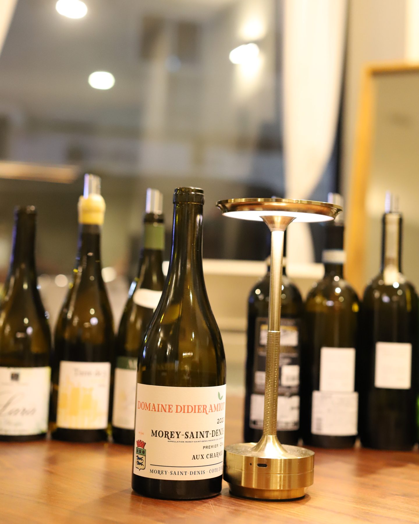 A bottle of Domaine Pierre Amiot et Fils Morey-Saint-Denis 1er Cru 'Aux Charmes' 2020.